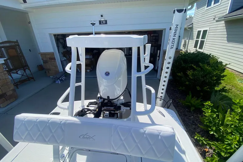 Slide: The Image of 2026 Chaos 16 Bonefish boat with Minn Kota motor in driveway. - 11