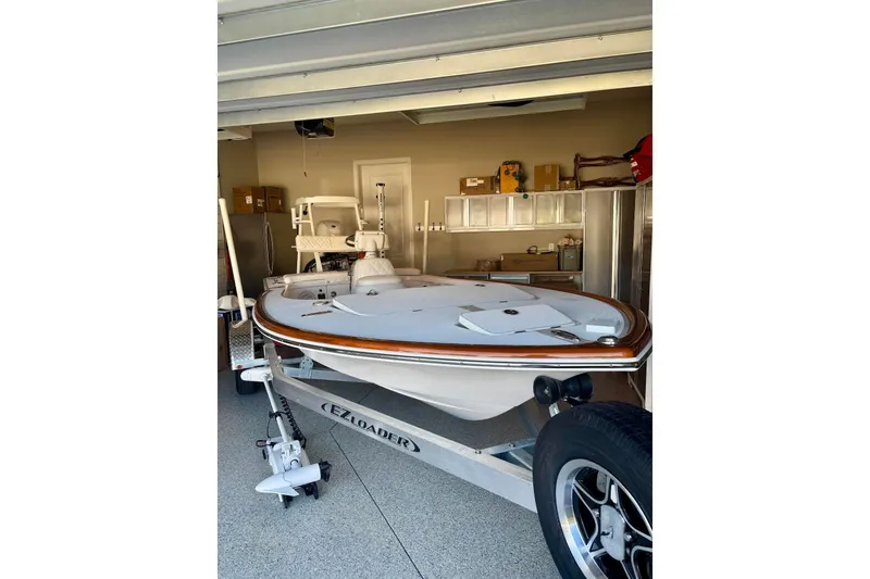 Slide: The Image of 2026 Chaos 16 Bonefish boat on trailer in garage setting. - 6