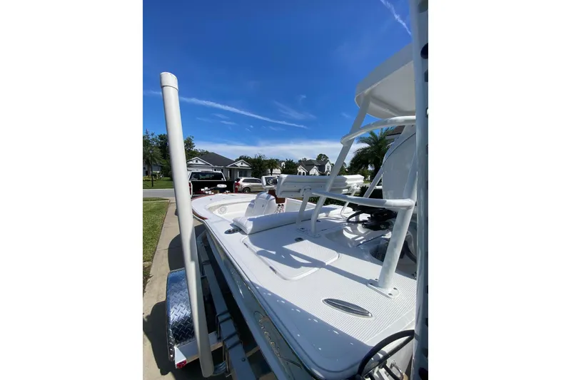 Slide: The Image of 2026 Chaos 16 Bonefish boat on trailer under clear blue sky. - 9