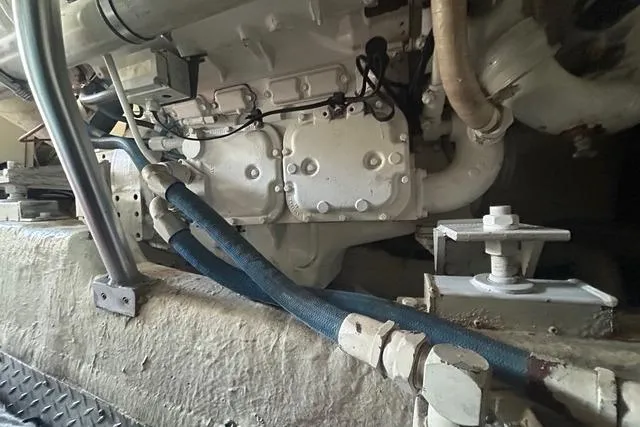 Slide: The Image of Engine compartment of a 1995 Ocean 53 Super Sport yacht, featuring pipes and mechanical components. - 25