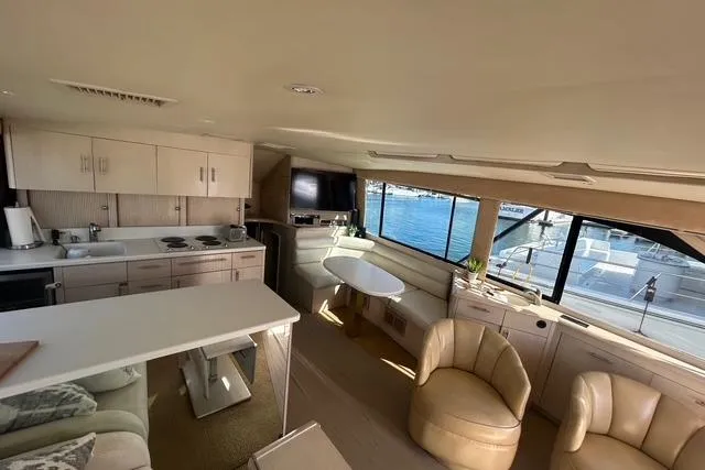 Slide: The Image of Interior of 1995 Ocean 53 Super Sport yacht with modern kitchen and seating area. - 5