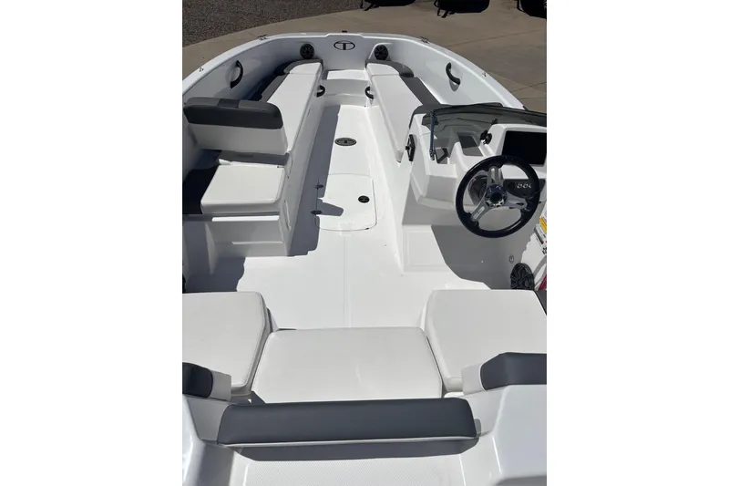 Slide: The Image of 2026 Tahoe T18 boat interior with sleek seating and modern steering console. - 6