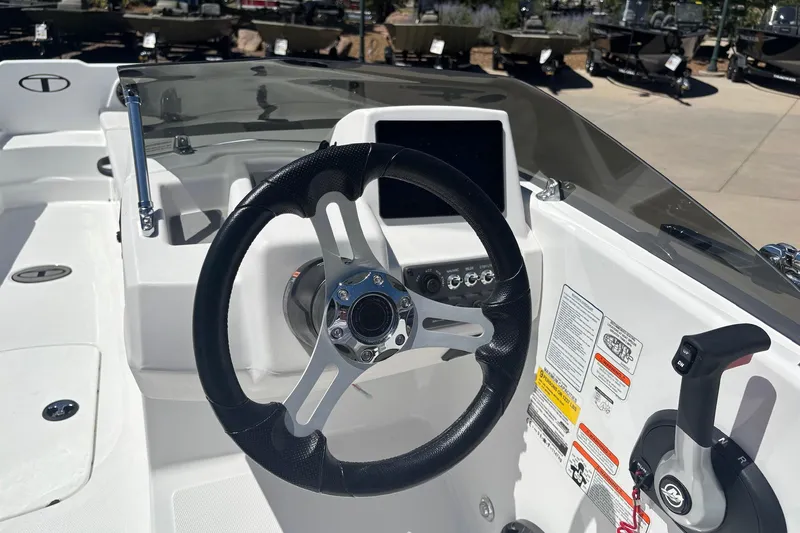 Slide: The Image of Steering console of 2026 Tahoe T18 boat with modern controls and sleek design. - 10