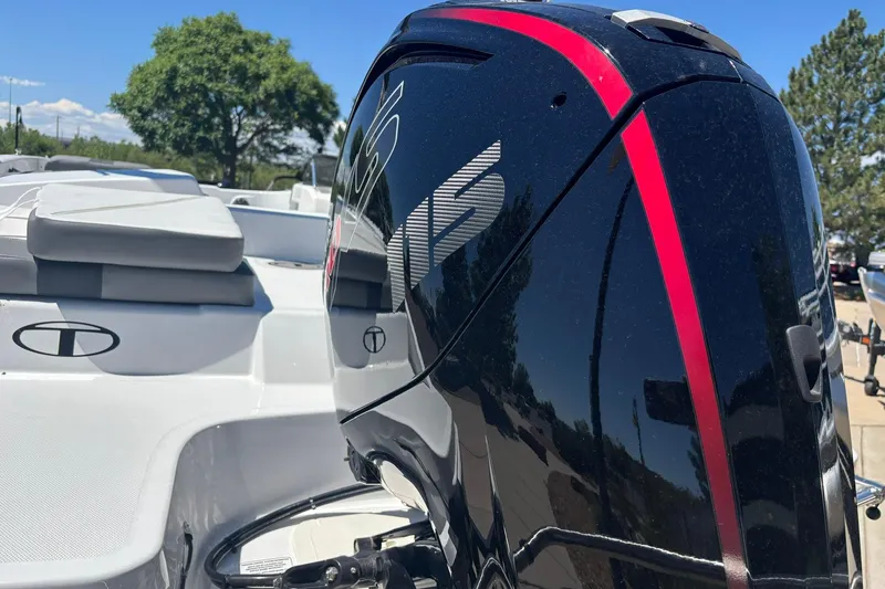 Slide: The Image of 2026 Tahoe T18 boat with sleek black and red motor, white seating, and outdoor setting. - 15