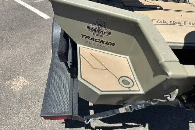 Slide: The Image of 2026 Tracker Grizzly 1756 T Marsh boat rear view, showcasing branding and design details. - 14