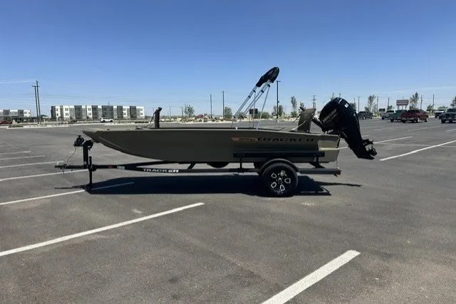 The Image of 2026 Tracker Grizzly 1756 T Marsh boat on trailer in parking lot. - 0