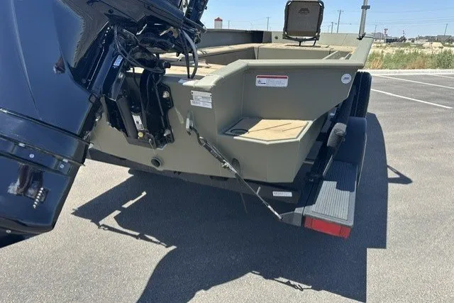 Slide: The Image of 2026 Tracker Grizzly 1756 T Marsh boat on trailer, rear view in parking lot. - 17