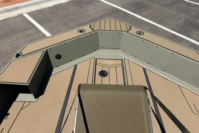 Slide: The Image of 2026 Tracker Grizzly 1756 T Marsh boat interior, featuring spacious seating and storage compartments. - 13
