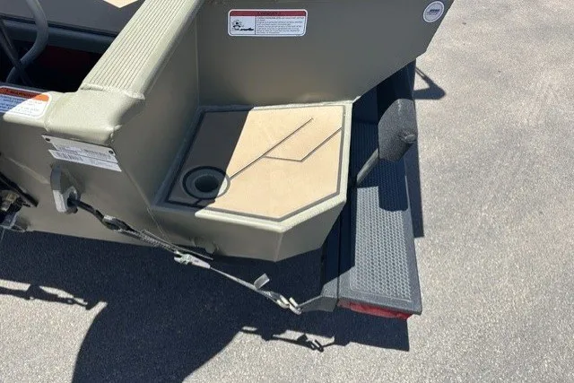 Slide: The Image of 2026 Tracker Grizzly 1756 T Marsh boat stern detail with non-slip step and storage compartment. - 15