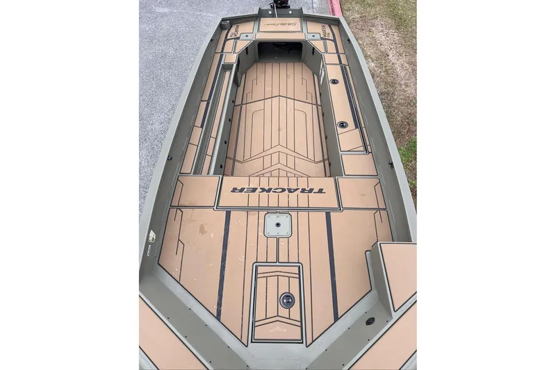 Slide: The Image of 2026 Tracker Grizzly 1756 T Marsh boat deck with tan and black design. - 46