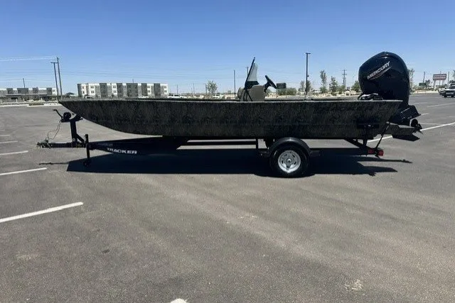 The Image of 2026 Tracker Grizzly 2072 CC boat on trailer in parking lot. - 0