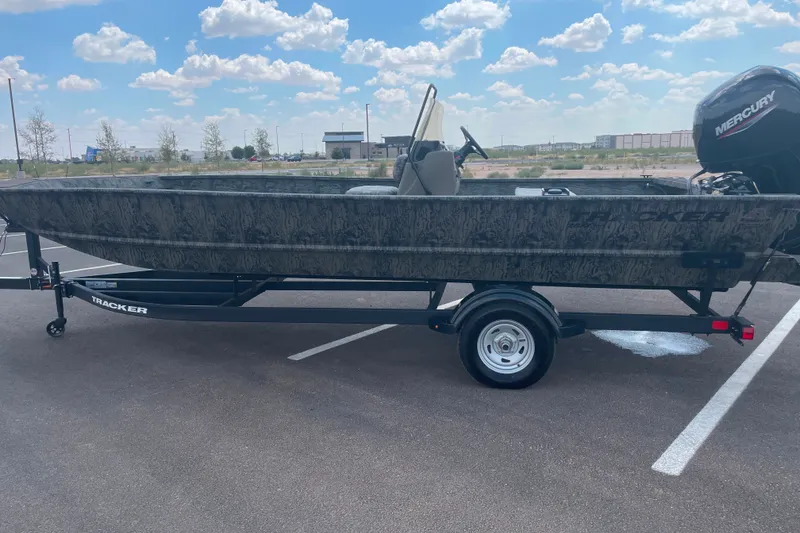 The Image of 2026 Tracker Grizzly 2072 CC boat on trailer in parking lot. - 0