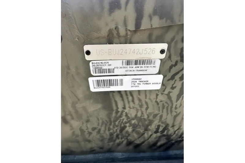 The Image of 2026 Tracker Grizzly 2072 CC identification tags on camouflage background. - 22