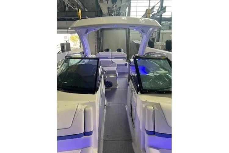 Slide: The Image of 2024 Formula 310 Bowrider OB boat interior with modern design and blue accent lighting. - 10