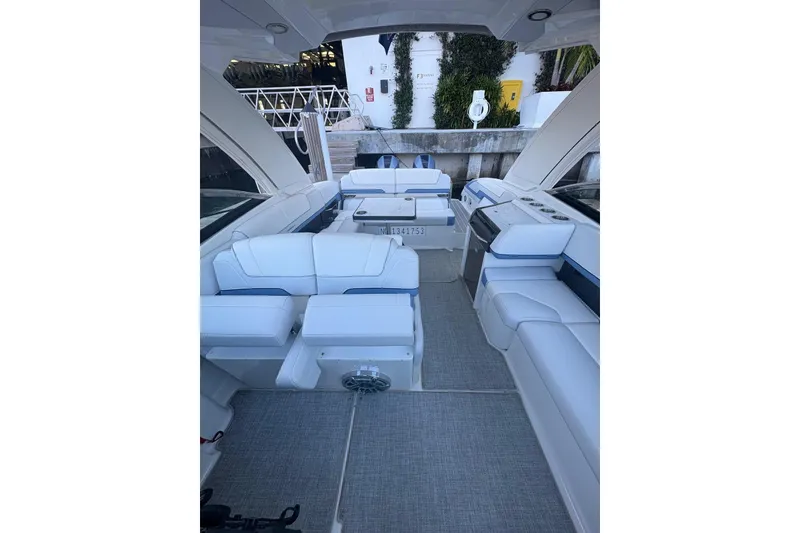Slide: The Image of 2024 Formula 310 Bowrider OB interior with luxurious white seating and modern design. - 13