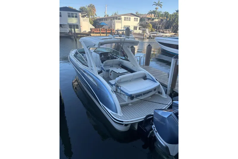 Slide: The Image of 2024 Formula 310 Bowrider OB docked, showcasing sleek design and spacious seating. - 24