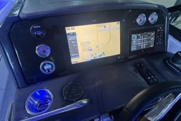 Slide: The Image of 2024 Formula 310 Bowrider OB dashboard with GPS and control panel. - 5