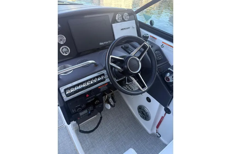 Slide: The Image of 2024 Formula 310 Bowrider OB helm with steering wheel and control panel. - 6