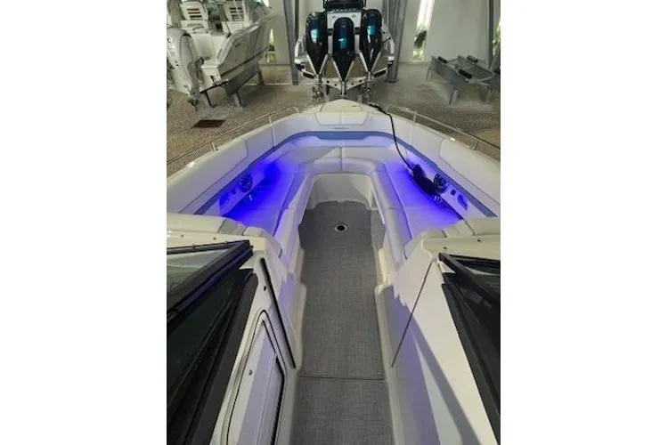 Slide: The Image of 2024 Formula 310 Bowrider OB with illuminated seating and modern design. - 8