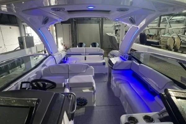Slide: The Image of 2024 Formula 310 Bowrider OB interior with blue LED lighting and luxurious seating. - 9