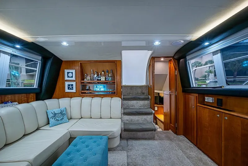 Slide: The Image of Luxurious interior of 2000 Silverton 442 Cockpit Motor Yacht with plush seating and elegant decor. - 20