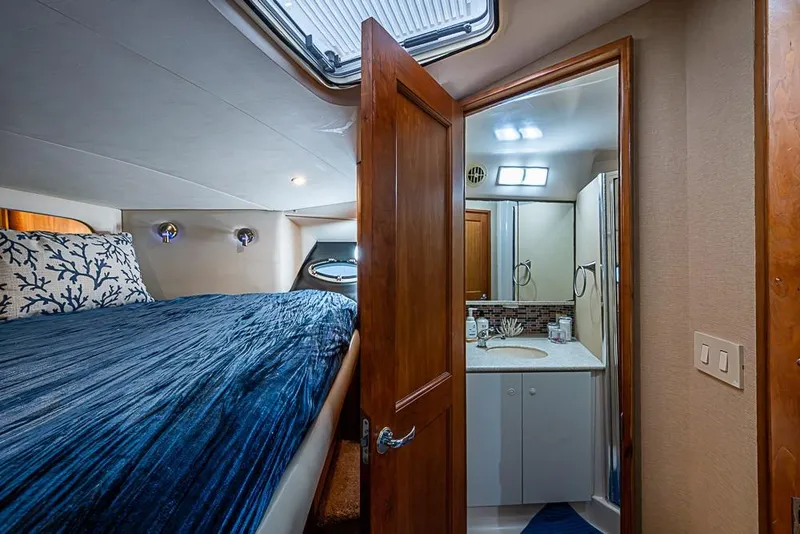 Slide: The Image of Luxurious cabin interior of 2000 Silverton 442 Cockpit Motor Yacht with ensuite bathroom. - 29