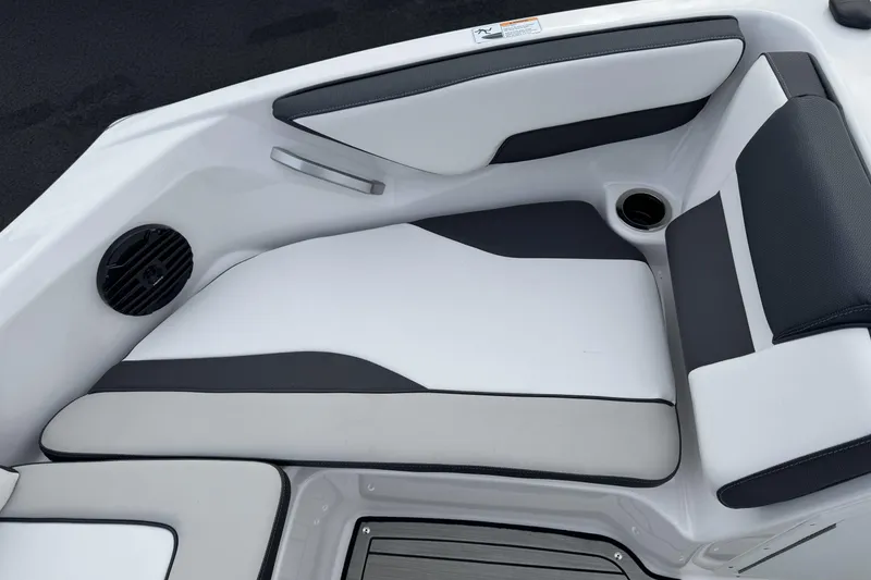 Slide: The Image of 2024 Yamaha Boats 195S interior seating with sleek design and integrated speaker. - 11