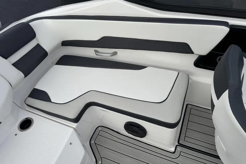 Slide: The Image of 2024 Yamaha Boats 195S interior seating with sleek white and black design. - 19
