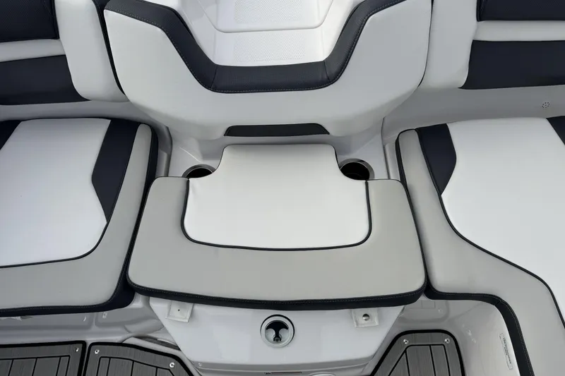 Slide: The Image of 2024 Yamaha Boats 195S interior seating with cup holders and sleek design. - 21