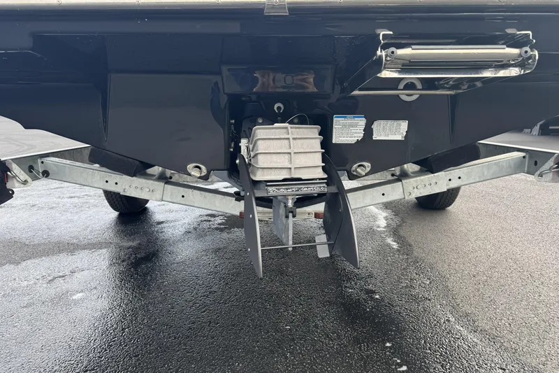 Slide: The Image of Rear view of 2024 Yamaha Boats 195S on a trailer, showcasing the propulsion system. - 26