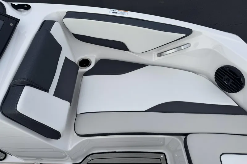 Slide: The Image of 2024 Yamaha Boats 195S interior seating with sleek black and white design. - 9