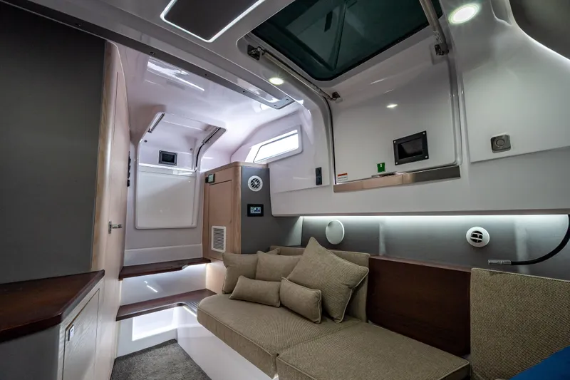 Slide: The Image of Luxurious interior of 2025 Axopar 45 Cross Top boat, featuring modern design and comfortable seating. - 30