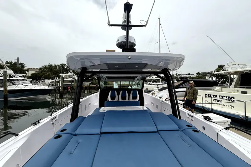 Slide: The Image of Overhead view of 2025 Axopar 45 Cross Top boat on clear blue water. - 5