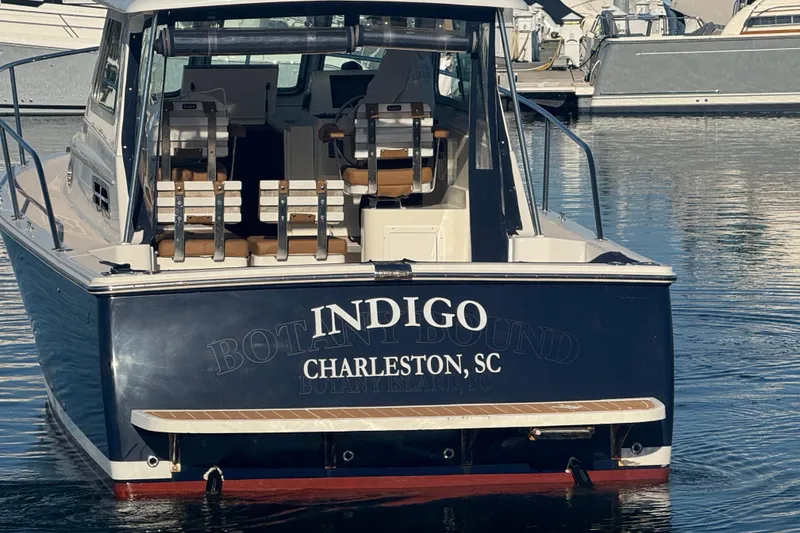 Slide: The Image of 2005 Back Cove 29 boat named "Indigo" docked in Charleston, SC marina. - 14