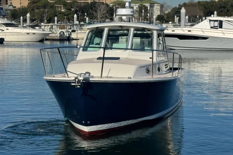 Slide: The Image of 2005 Back Cove 29 boat docked in a marina, front view. - 22