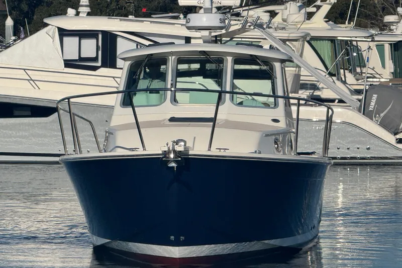 Slide: The Image of 2005 Back Cove 29 boat docked in marina, front view. - 3