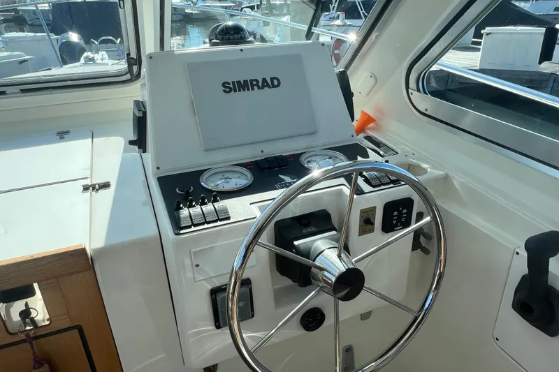 Slide: The Image of Helm of 2005 Back Cove 29 boat with Simrad navigation system. - 33