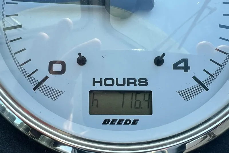 Slide: The Image of Hour meter showing 716.9 hours on a 2005 Back Cove 29 boat. - 36