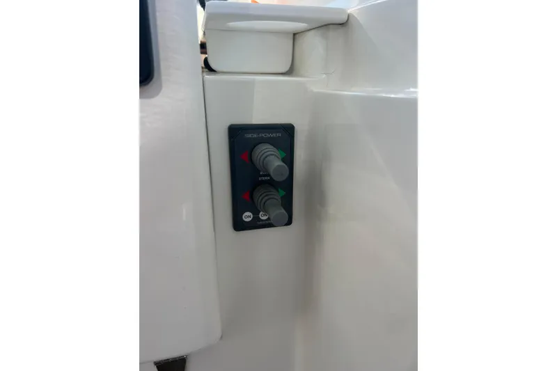Slide: The Image of Control panel on a 2005 Back Cove 29 boat, featuring side-power controls. - 38