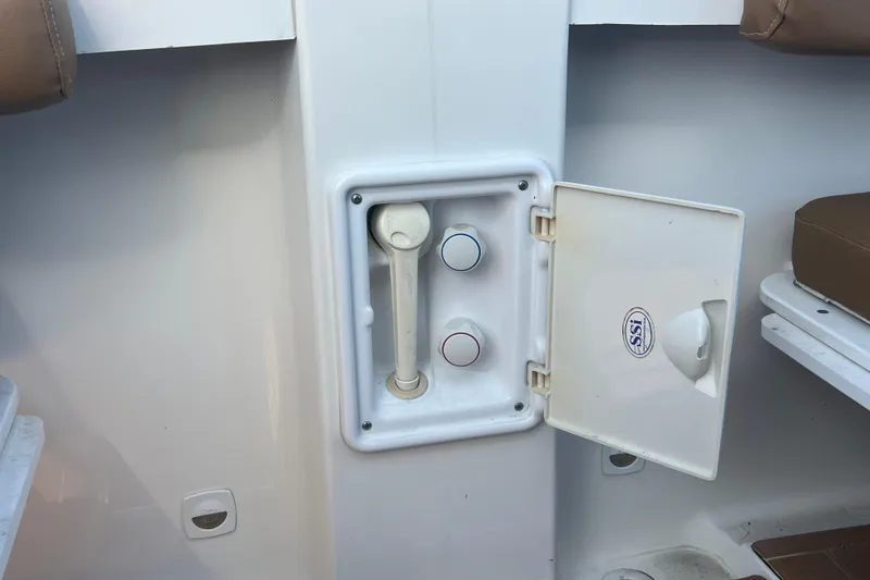 Slide: The Image of 2005 Back Cove 29 boat shower compartment with open door and controls. - 62