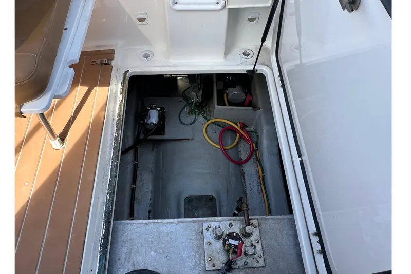 Slide: The Image of Engine compartment of a 2005 Back Cove 29 boat, showing wiring and components. - 63