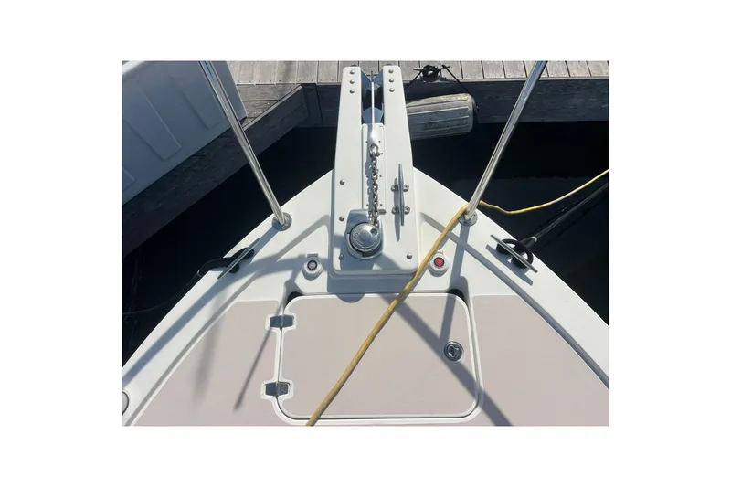 Slide: The Image of Bow of 2005 Back Cove 29 boat with anchor and dock lines. - 64