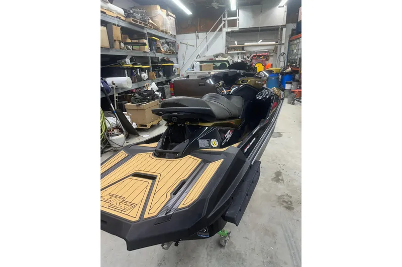 Slide: The Image of 2023 Kawasaki Jetski Ultra 310LX in a workshop setting, showcasing sleek design and features. - 10