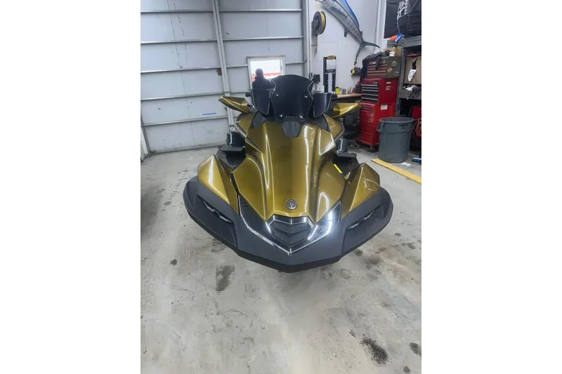 Slide: The Image of 2023 Kawasaki Jetski Ultra 310LX in a garage setting. - 2