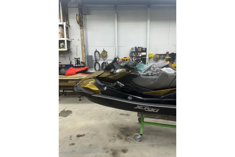 Slide: The Image of 2023 Kawasaki Jetski Ultra 310LX in a garage setting. - 6