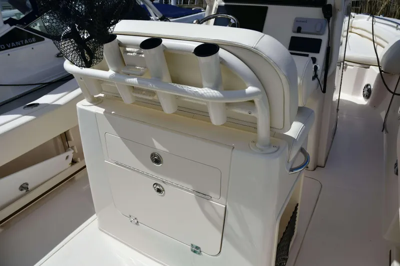 Slide: The Image of 2023 Grady-White Fisherman 257 boat interior with rod holders and storage compartments. - 15