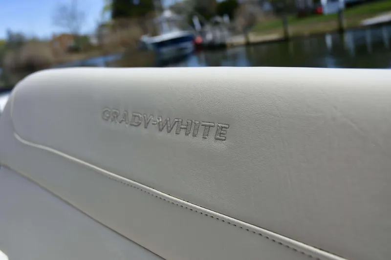 Slide: The Image of Grady-White Fisherman 257 boat seat detail, showcasing embossed branding, 2023 model. - 16