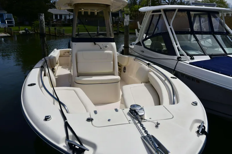 Slide: The Image of 2023 Grady-White Fisherman 257 boat docked, showcasing spacious seating and sleek design. - 22