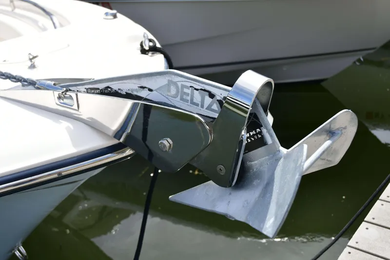 Slide: The Image of Anchor detail on 2023 Grady-White Fisherman 257 boat, docked in marina. - 23