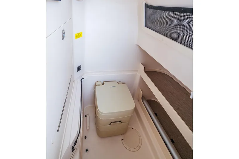 Slide: The Image of Manufacturer Provided Image: 2023 Grady-White Fisherman 257 boat interior with portable toilet. - 5